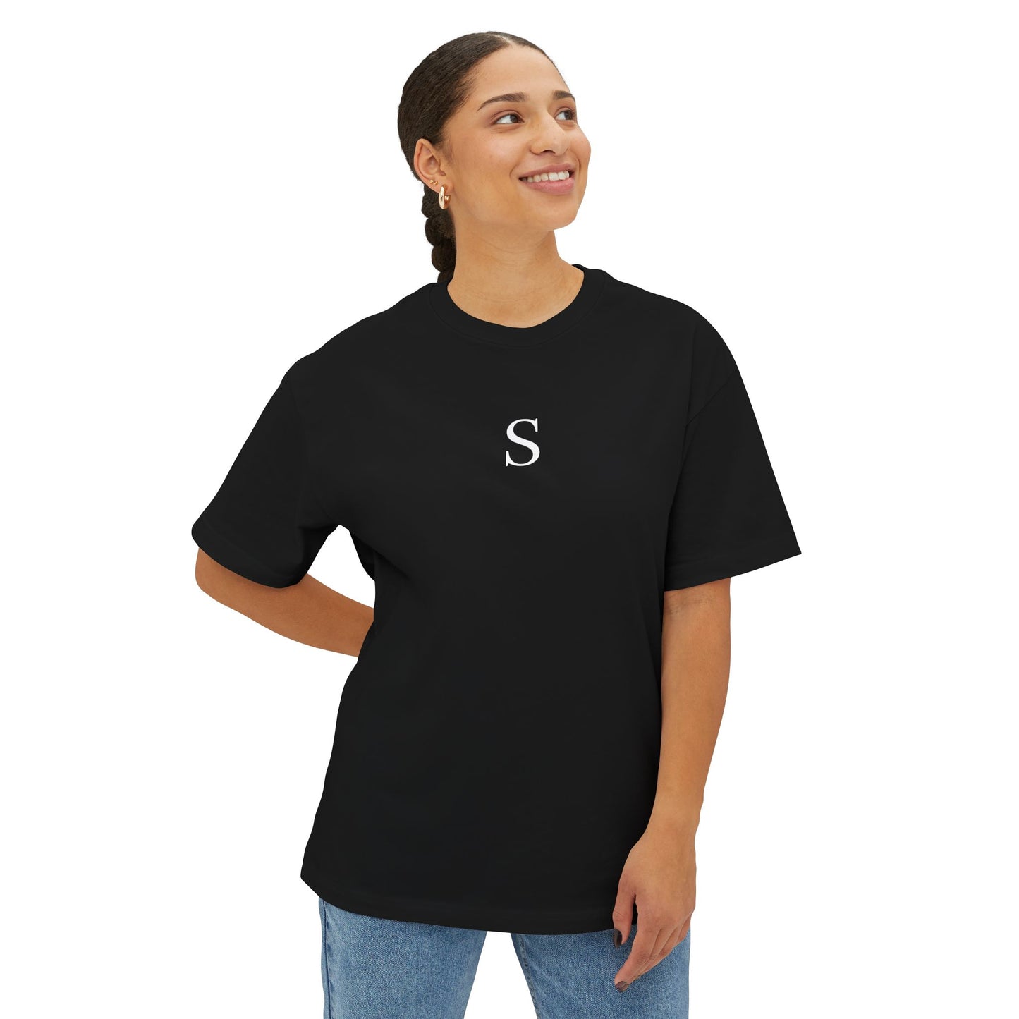 Person wearing a black t-shirt with a white letter 'S' on a white background
