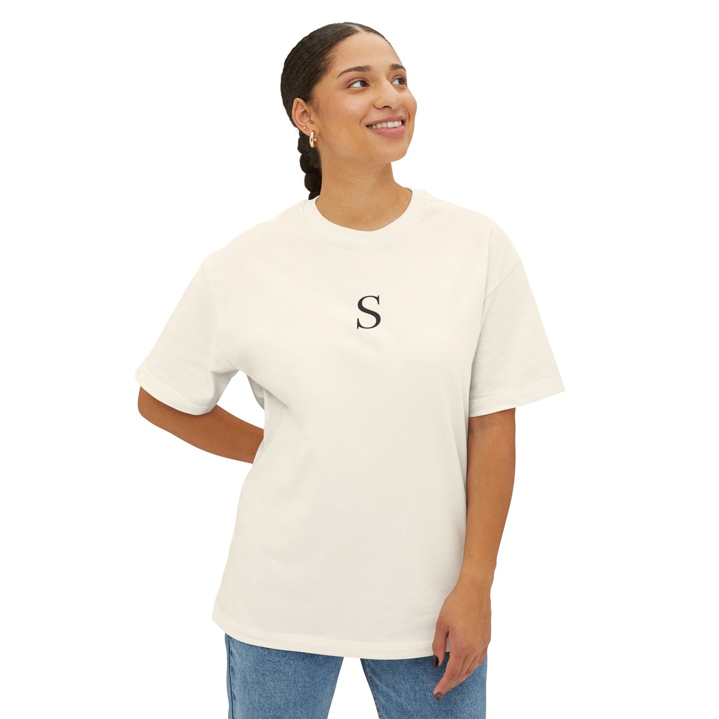 Woman wearing a white t-shirt with a letter 'S' on a white background