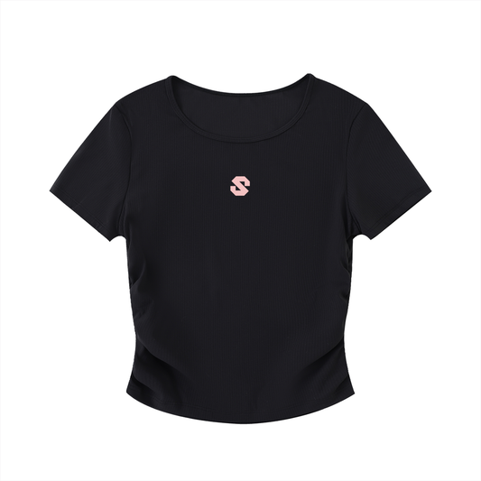 Black t-shirt with a small pink logo on a white background